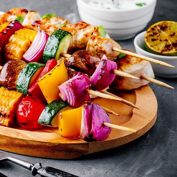 Grilled vegetable and chicken skewers with sweet corn, paprika, zucchini, onion, tomato and mushroom