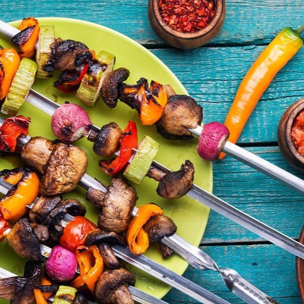 Skewers of grilled vegetables.Vegetable kebabs with peppers, mushrooms, zucchini and tomatoes