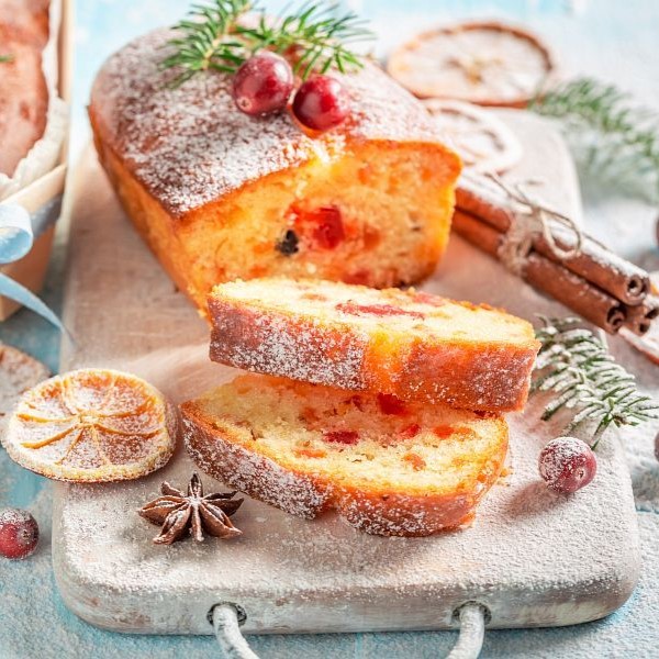 Homemade Fruitcake for Christmas decorated with spruce